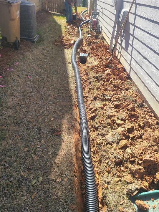 Stone retaining wall and grading project