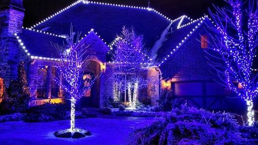 Landscape and holiday lighting installation by JDS Landscape Group at dusk